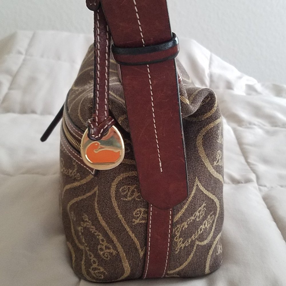 Dooney & Bourke coffee and amber canvas small hobo. Preowned.